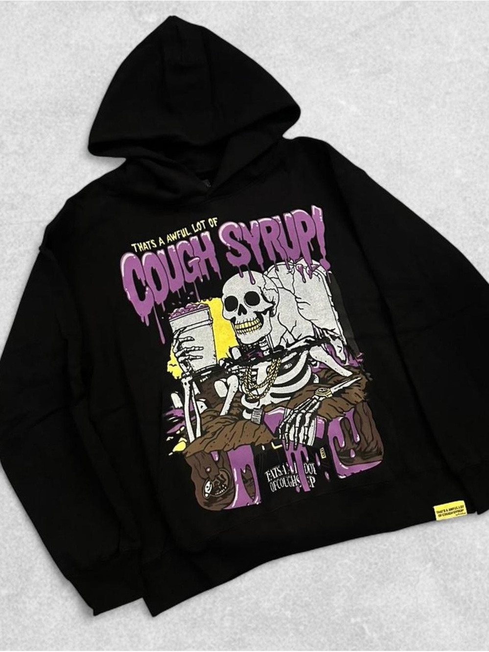 Black Graphic Hoodie with Purple 'Cough Syrup' Skeleton Print